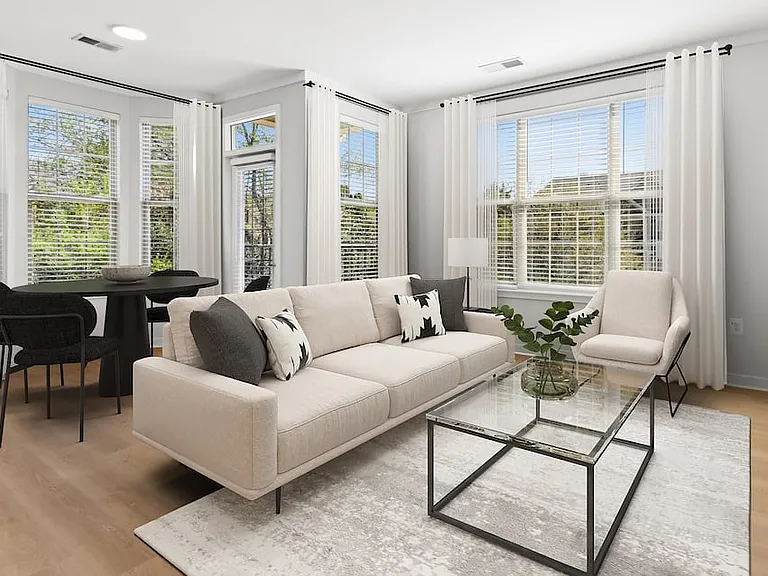 Renovated Package II dining and living room with hard surface flooring
