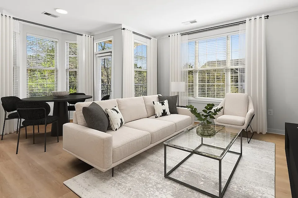 Renovated Package II dining and living room with hard surface flooring