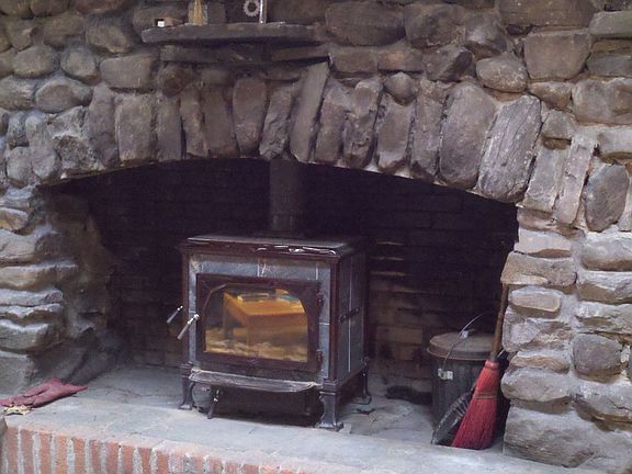 Soapstone stove in fireplace