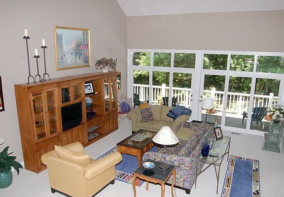 Huge open great room with scenic view of wooded lot.