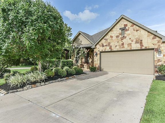 Beautiful stone exterior situated on a well-manicured corner home site with an over-sized 2 car garage with epoxy flooring.