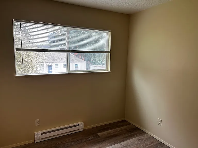 Bedroom with new mini-blinds and new flooring