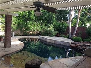 BACKYARD OASIS includes pool/spa with 5 pool jets and 11 spa jets with booster, rock waterfall, flag