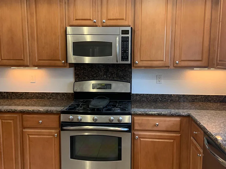 Cherry cabinets and lots of storage!