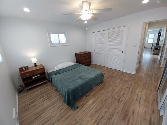NE bedroom showing large closet, ceiling fan