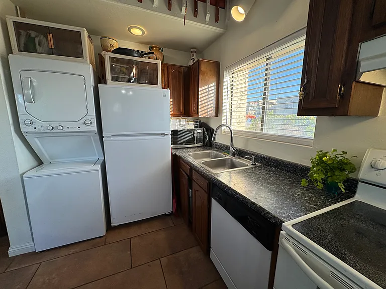 Kitchen with washer/dryer.