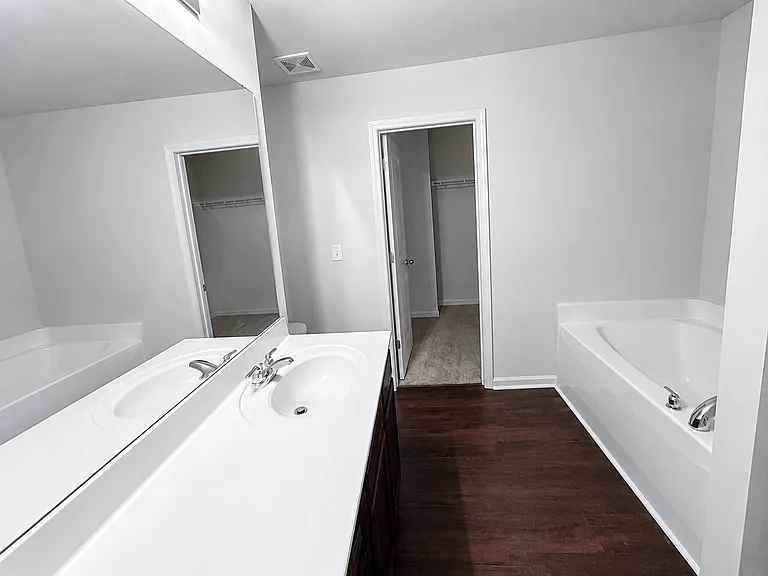 Primary full bathroom with walk-in closet