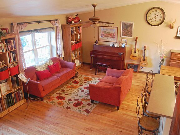 Great room offers family sitting area, dining, and open conc
