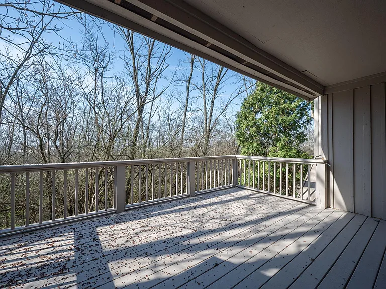 Upper level deck with wooded private backyard