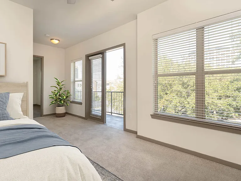 Carpeted Bedroom with Balcony