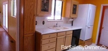 Kitchen 2 of 2 : Window overlooks backyard; hot tub area to right.