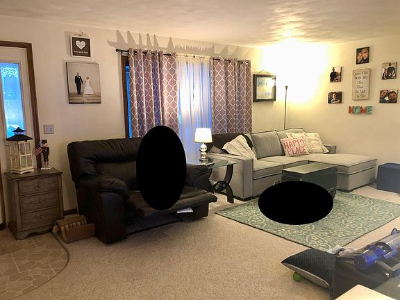 Spacious living room with corner fireplace