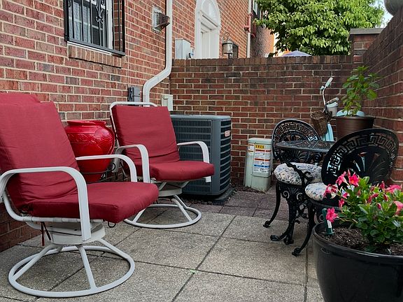 Fenced in patio with street entry door.