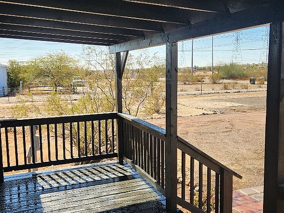 Porch view looking southwest. additional parking area and house shoe pit.
