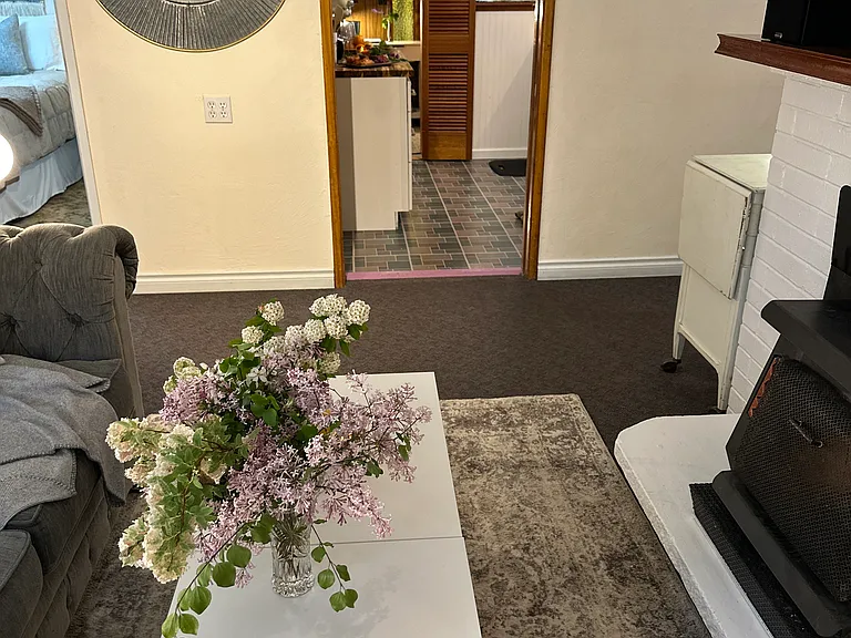 Kitchen is conveniently located between the two bedroom areas.