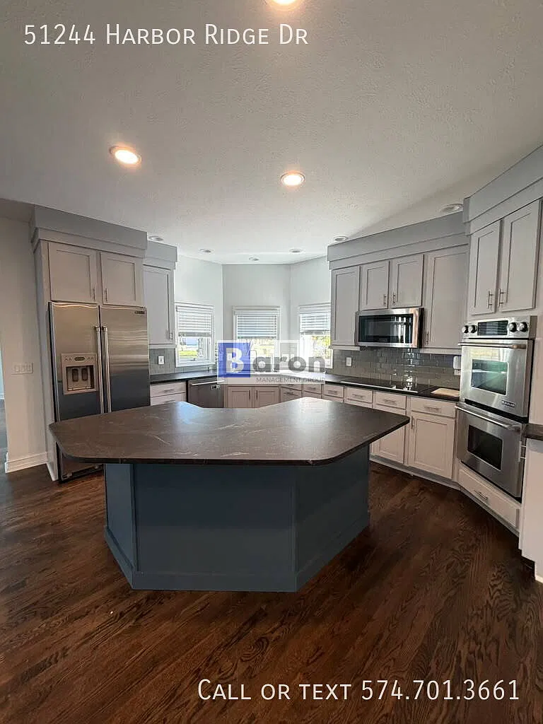"Luxury Living Awaits: Spacious 4-Bedroom Home. Gleaming Hardwood Floors in Granger, IN!" — Photo 2