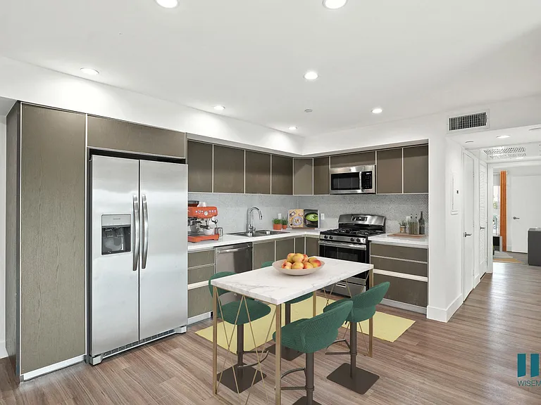 Open-Concept Kitchen with Staineless-Steel Refrigerator, Stove, Microwave Oven, and Dishwasher