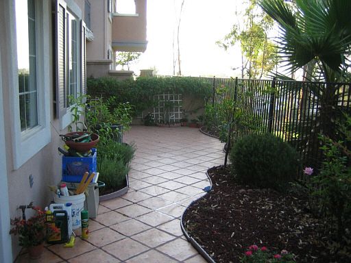 Patio what room for standard table and 4 chairs on far end by master bedroom