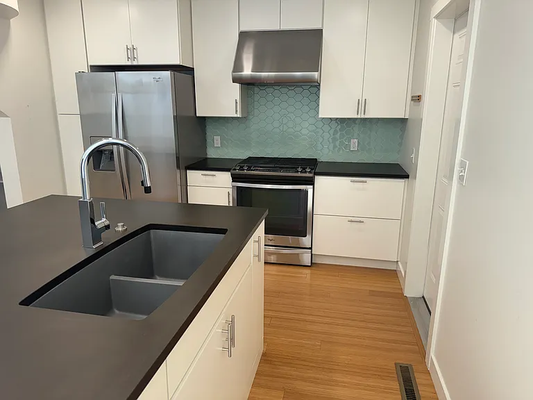stainless steel appliances in great condition with wood cabinets and under cabinet lighting
