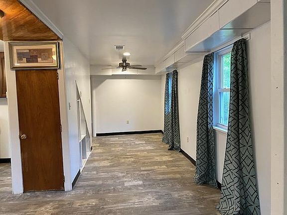 Living Room with coat and shoe closet.