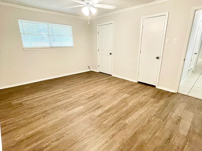 Main bedroom with two closets. Ensuite bath. Ceiling fan. New flooring