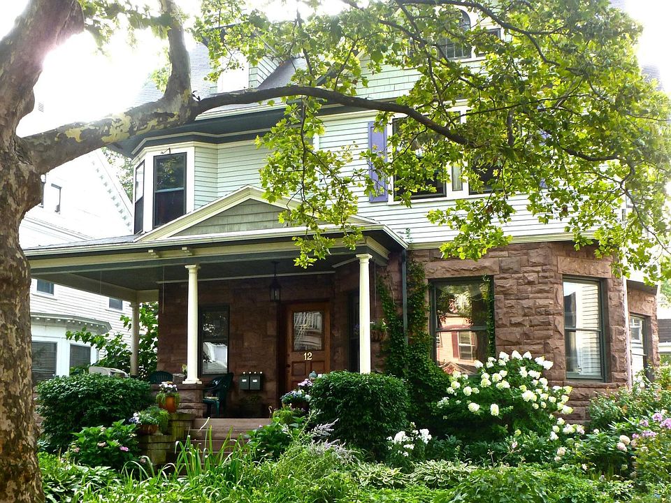 Apartment is at 1882 Historic Queen Anne with Medina Stone and gprgepus front garden on Landmark Strathallan Park between East Avenue and the Art Gallery in the prestigious East End.