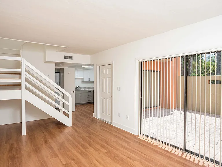Spacious living room with wood flooring throughout