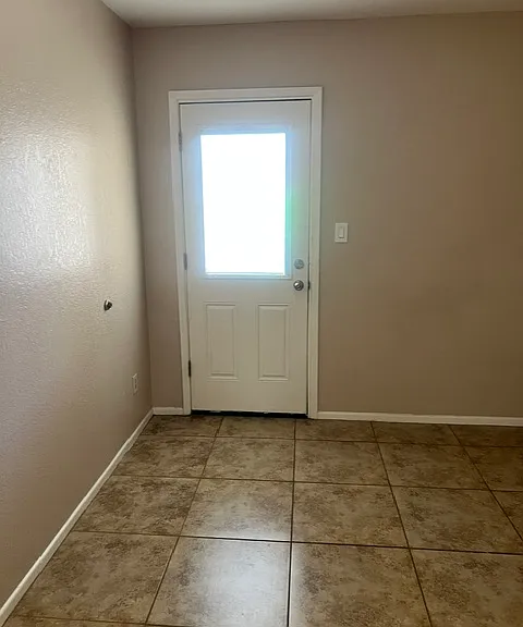 door to backyard in bedroom 2