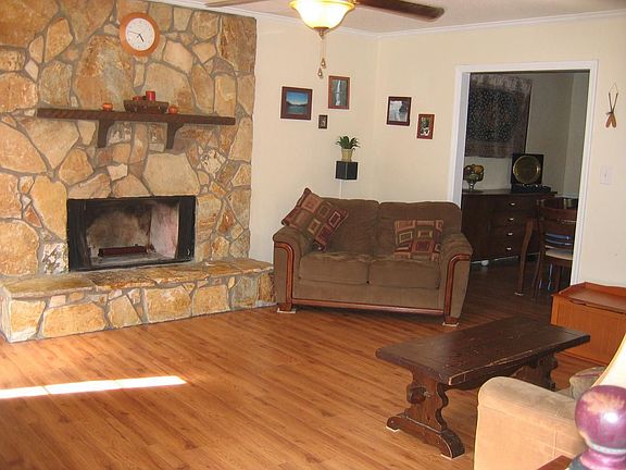 Newly laid laminate throughout living spaces, large living room