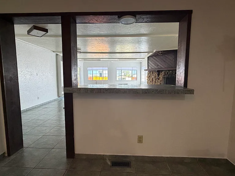 The double-sided breakfast nook opens to the stunning entertainment room.