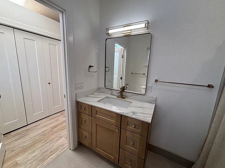 primary bath vanity and full closet