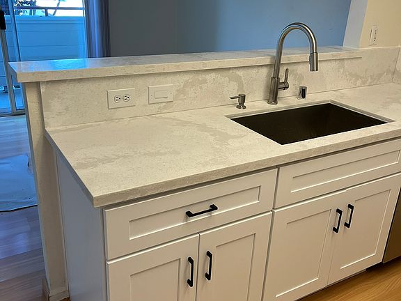 New Sink, Fixtures, Countertops and Wood Cabinets