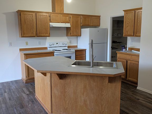 Large spacious kitchen with large cabinets and counter space.