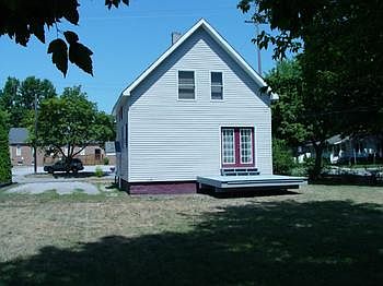 Large deck overlooking back yard with room for a garage and kids and dogs to play.