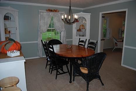 dining room with built-in corner cabinets