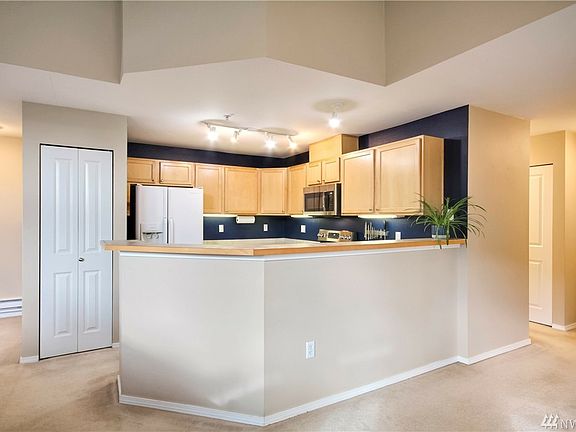 Spacious kitchen with pantry closet, lots of counters & cabinet space. 