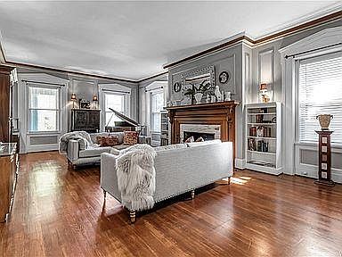 front living room with a large gas fireplace
