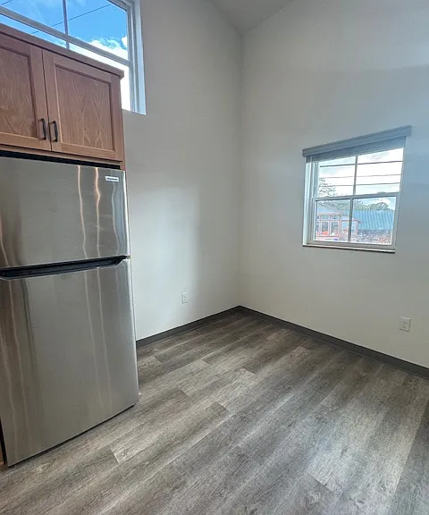 stainless steel appliances in kitchen open concept living area