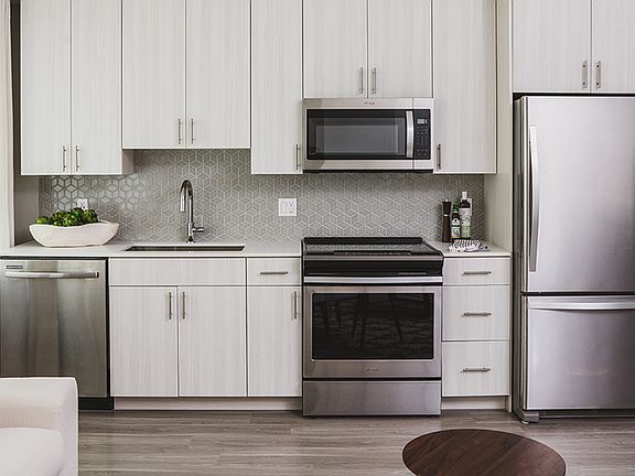 Stunning kitchens with stainless steel appliances and gorgeous tile backsplash