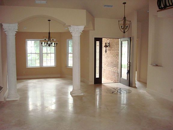 Viwe of front entance and dining room with columns