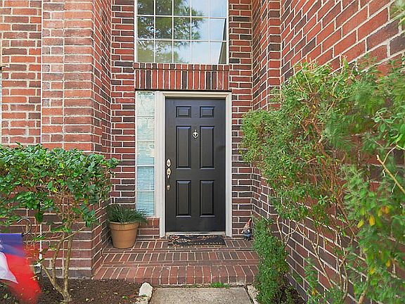 A covered front stoop welcomes you into your new home.