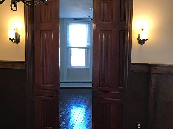 Dining room looking into living room (pocket doors partially closed).