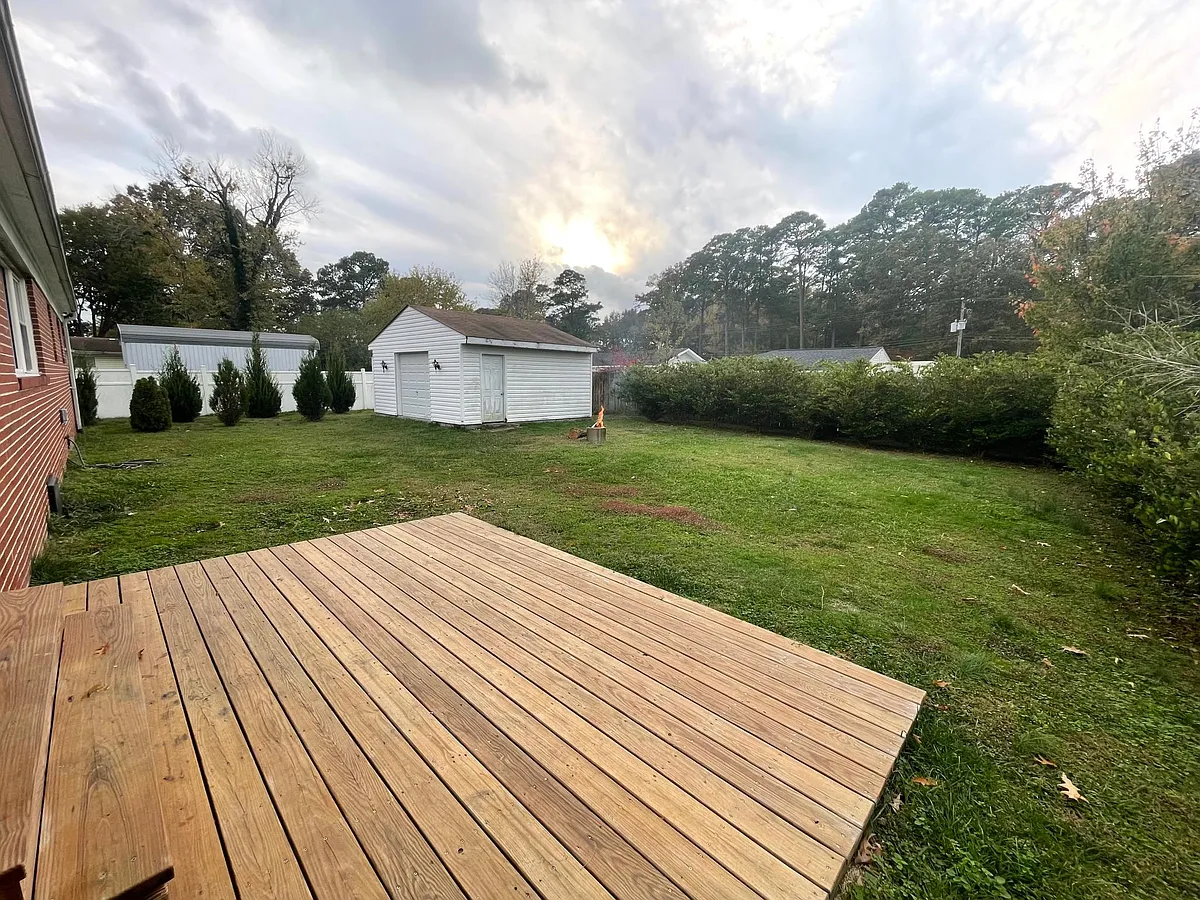 Recently installed deck (2020). Detached garage is partial garage, partial custom home office. - 569 Caren Dr