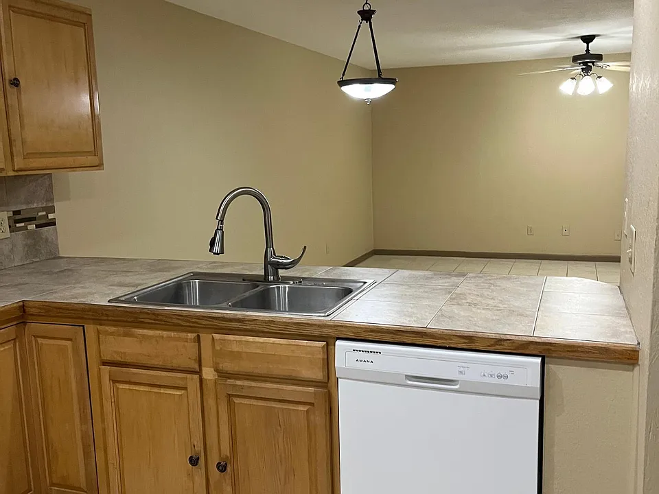 kitchen looking out to dining and living room combo