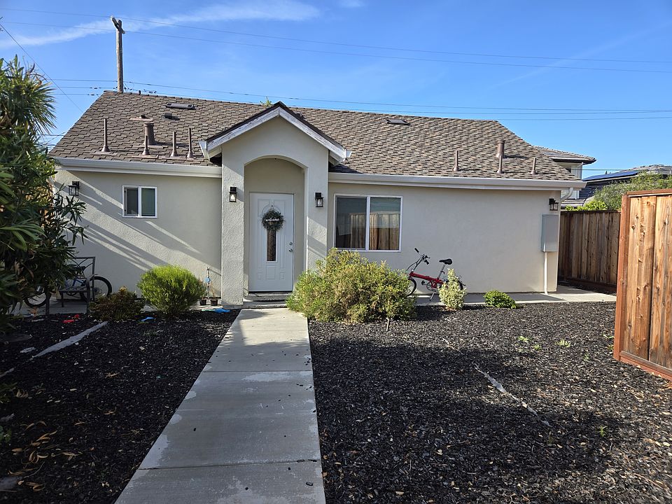 Front entrance to the private home with large front yard