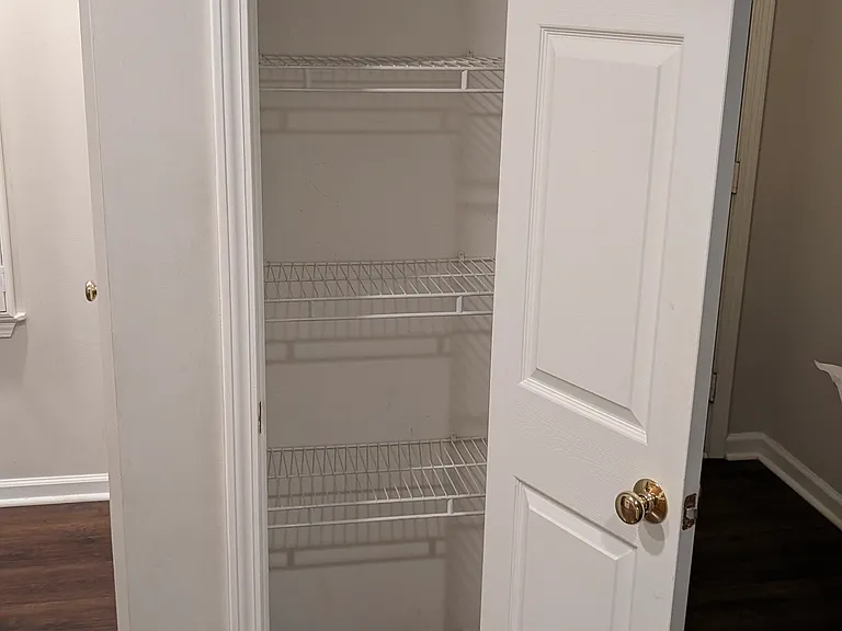 Pantry closet with built-in shelving.