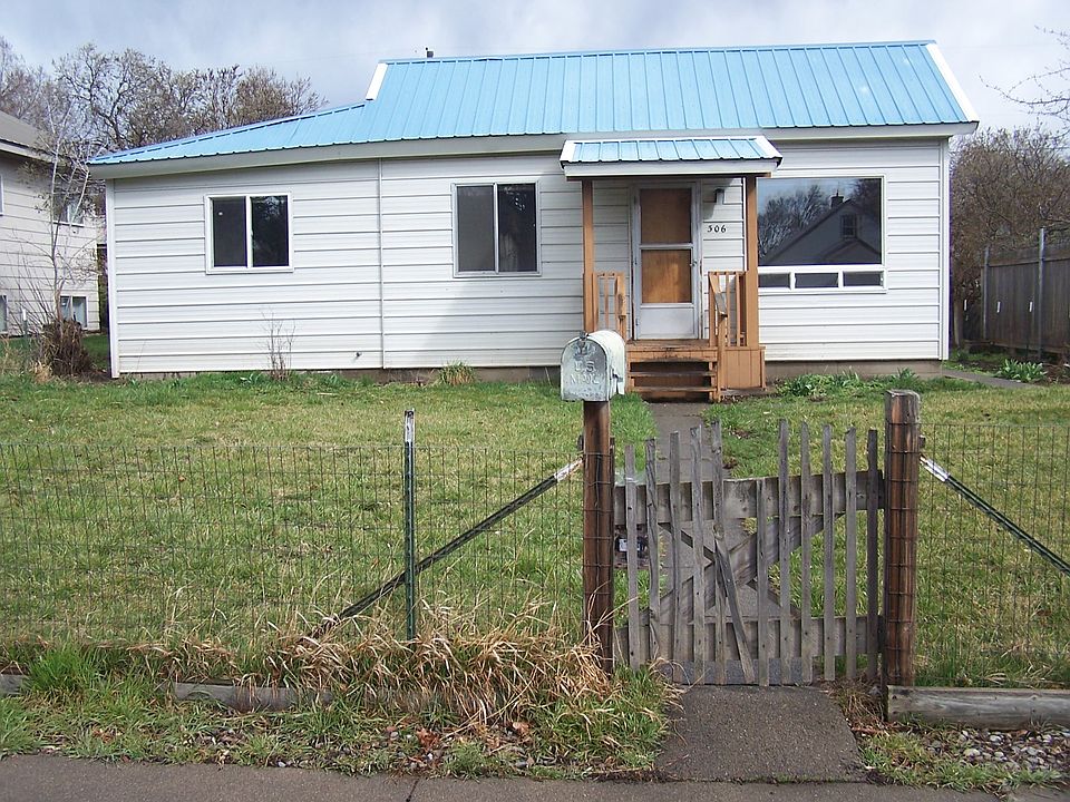 house with fenced front yard