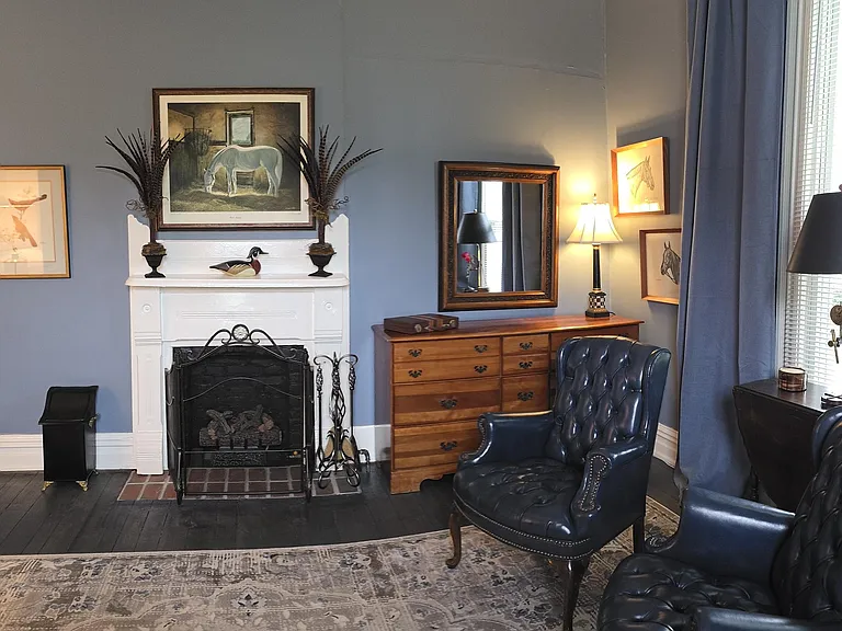Panoramic view from front center of bedroom - mirror/dresser; book shelves. Room can convert to office, game room or exercise room (bed flips up to store); table opens up and other furniture can be added per tenant's preference.