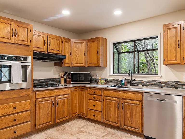 One full size refridgerator with freezer is provided but not shown in the picture. A pantry is located in this kitchen but will be locked and off limits.