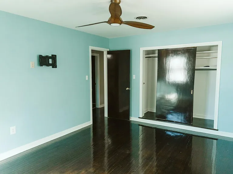 Bedroom 1 with large closet and ceiling fan